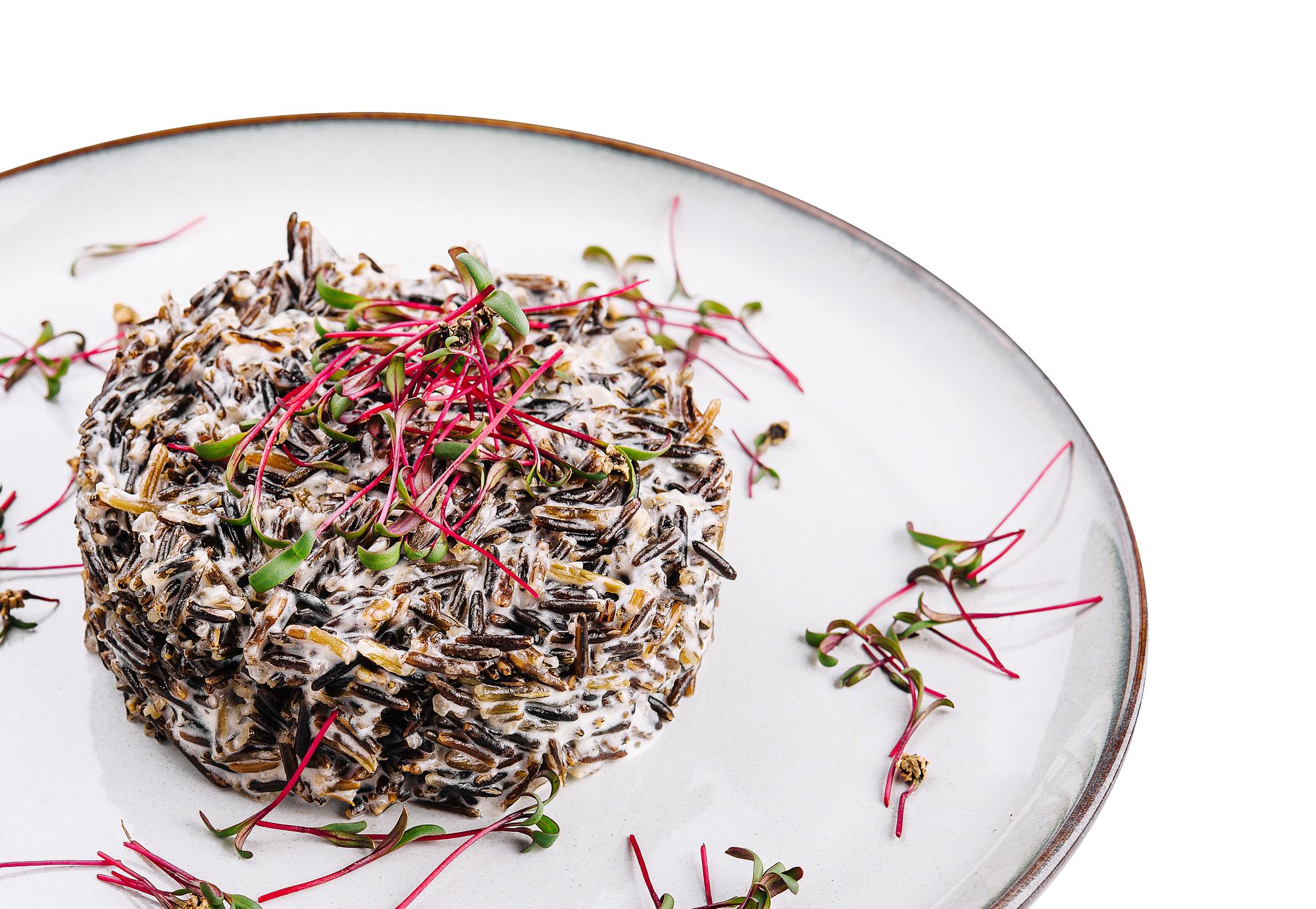 Close-up of plated appetizer with microgreens