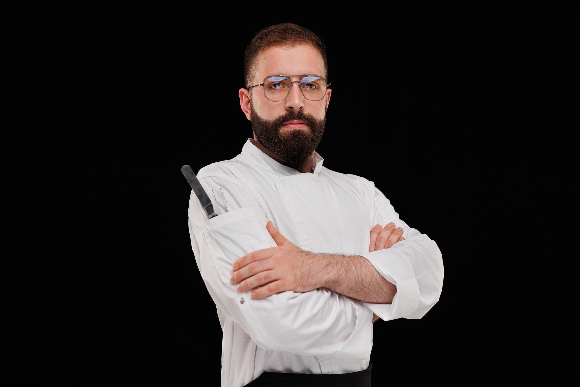Portrait of head chef with folded arms